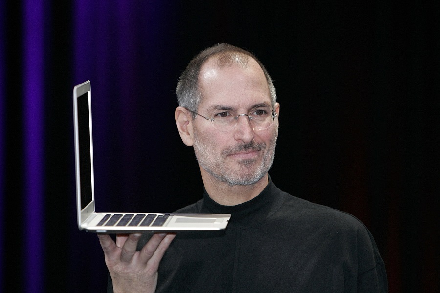 SAN FRANCISCO - JANUARY 15:  Apple CEO and co-founder Steve Jobs holds up the new Mac Book Air after he delivered the keynote speech to kick off the 2008 Macworld at the Moscone Center January 15, 2008 in San Francisco, California.  Jobs introduced the wireless Time Capsule backup appliance, iTV 2 and the new ultra thin laptop MacBook Air.  (Photo by David Paul Morris/Getty Images)